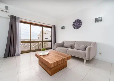 a living room with a couch and a coffee table at 404 - Oura - 2 Bedroom - Sea View in Albufeira