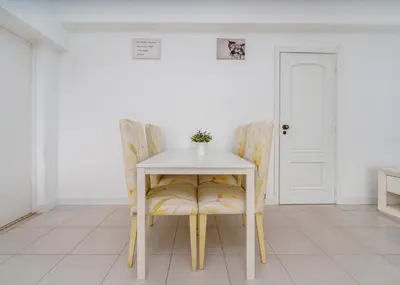 a table and chairs in a room with a white table and chairs at 404 - Oura - 2 Bedroom - Sea View in Albufeira