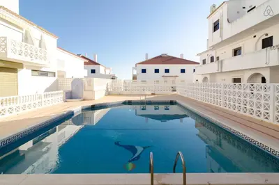 a swimming pool in the middle of a building at 404 - Oura - 2 Bedroom - Sea View in Albufeira