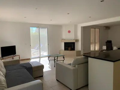 a living room with a couch and a table at Villa Sofia in Almancil