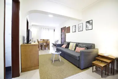 a living room with a couch and a table at Aqua Plaza 2 Bedr swimming pool 5 min to the beach in Olhos de Água