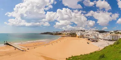 a view of a beach with people on it at Aqua Plaza 2 Bedr swimming pool 5 min to the beach in Olhos de Água