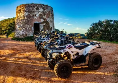 a four wheeler parked in front of a stone tower at Oldtown Starfish Beach House 2 min to the beach Wifi in Albufeira