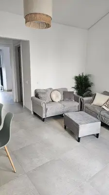 a living room with a couch and a coffee table at City Center Villa in Faro