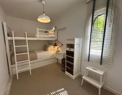 a bedroom with two bunk beds and a window at Vilamouratenis White by SAPvillas in Vilamoura