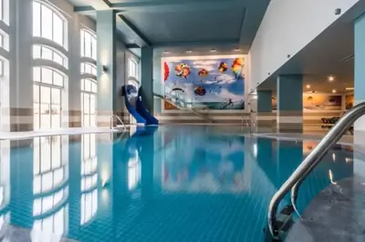 a swimming pool with a slide in a building at Self-Catering Studios & Apartments at Hotel Cerro Alagoa in Albufeira