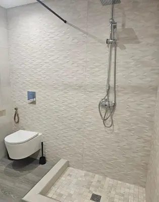 a bathroom with a shower with a toilet in it at Oldtown Nightlife in Faro
