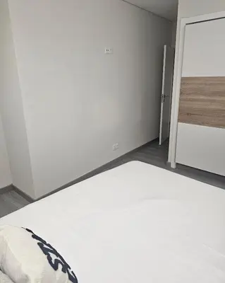 an empty room with a bed and a closet at Oldtown Nightlife in Faro