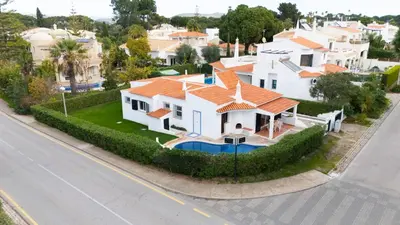 an aerial view of a white house with orange roofs at Villa Uno by HelloVacations in Loulé