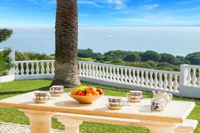 a table with a bowl of fruit on top of it at Casa Sol in Albufeira