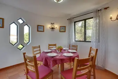 a living room with a couch and a fireplace at Villa Praia in Albufeira