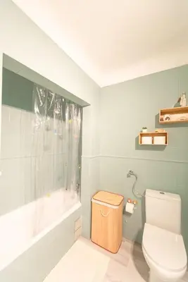 a bathroom with a white toilet and a bath tub at Albufeira Central Studio w swim pool and Seaview in Albufeira