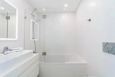 a white bathroom with a sink and a mirror at Villa Marina - 33 by HelloVacations in Albufeira