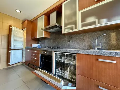 a kitchen with a dish washer in the middle at Quarteira Stylish 3 with Pool by Homing in Quarteira