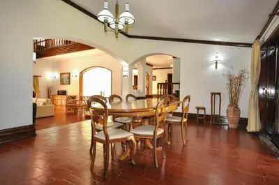 a dining room with a table and chairs at Villa Gardenia in Quarteira