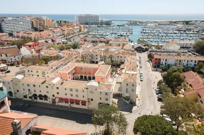 an aerial view of a city with a harbor at LUIS - Vilamoura in Vilamoura