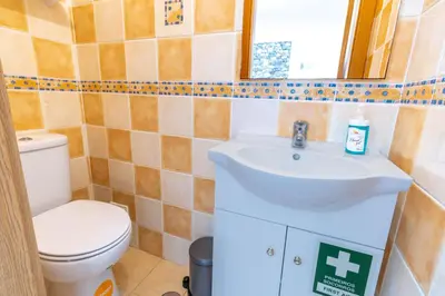 a kitchen with white cabinets and a refrigerator at #039 Family Private Pool AC in Albufeira