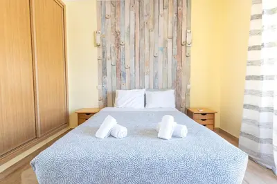a bathroom with a tub and a shower curtain at #039 Family Private Pool AC in Albufeira