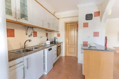 a bedroom with a bed with towels on it at #039 Family Private Pool AC in Albufeira