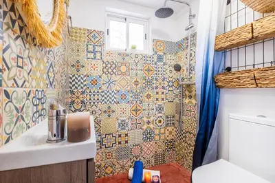 a bathroom with a shower with a toilet and a sink at Casa do Cacto in Olhos de Água