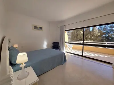a bedroom with a bed and a large window at Marina Mar Retreat by SAPvillas in Vilamoura
