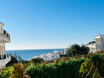 a view of the ocean from a building at Brisamar Villas OCEANS in Albufeira