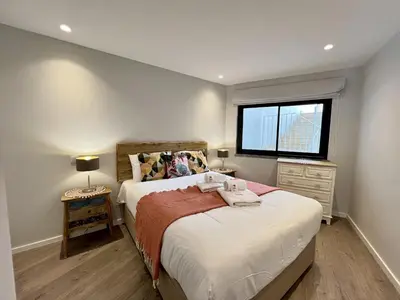 a small bedroom with a bed and a window at Albufeira Stylish 2 With Pool by Homing in Albufeira