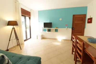 a living room with a couch and a television at Old Town Apartments 2D in Albufeira