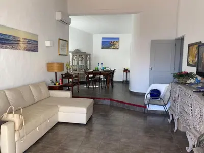 a living room with a couch and a table at Villa Snoppy in Albufeira