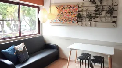 a living room with a couch and a table at Casa da Baixa in Faro