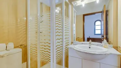 a bathroom with a sink and a shower at Villa Frederique in Albufeira