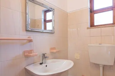 a bathroom with a sink and a mirror at Villa Andrea in Albufeira