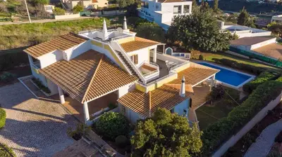 an aerial view of a house with a swimming pool at Villa Andrea in Albufeira