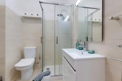 a bathroom with a shower and a toilet and a sink at ELI FLAT just few steps from the Strip in Albufeira in Albufeira