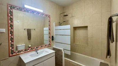 a bathroom with a sink and a mirror at Vilanova by Check-in Portugal in Albufeira