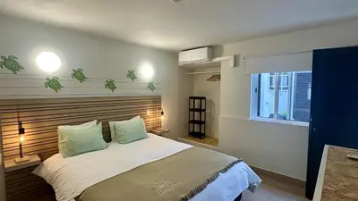 a bedroom with a large bed and a window at Vilanova by Check-in Portugal in Albufeira