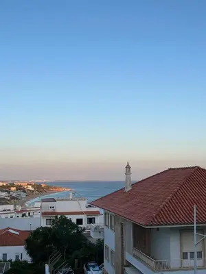 a view of a town with a lighthouse on top of a building at TAC - Cerro Belo in Albufeira