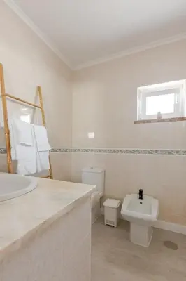 a white bathroom with a sink and a toilet at BrisaMarVilas Sea view, 5 min Walk to Town & Beach 12e13 in Albufeira