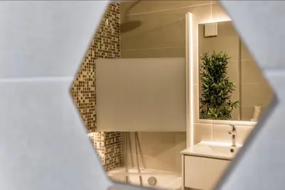 a bedroom with two beds and a flat screen tv at Sunny 3-Bedroom Apartment in Albufeira