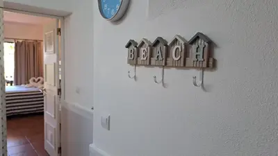 a house sign on a wall in a room at SÃO RAFAEL BEACH Apartment 55 in Albufeira