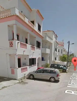 a car parked in front of a building at Albufeira studio in Albufeira