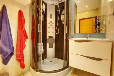 a bathroom with a shower and a sink at Modern Vacation Home With Pool In Quarteira in Quarteira