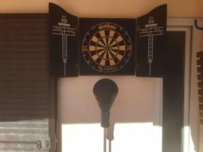 a dart board on a wall next to a door at Vale do Lobo 5 Bed Villa with Large Pool overlooking Golf Course in Almancil