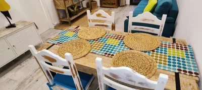 a table with straw hats on top of it at Albufeira View Sea Apartment Luxury in Albufeira