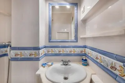 a bathroom with a sink and a mirror at Albufeira View Sea Apartment Luxury in Albufeira