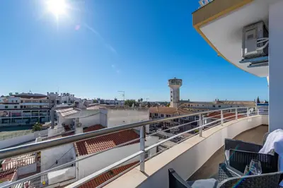a balcony with chairs and a view of a city at Apart OCEAN DRIVE - Oura - Jacuzzi - BY BEDZY in Albufeira
