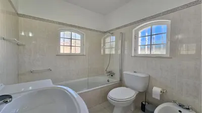 a white bathroom with a sink and a toilet at Villa Den, private pool villa, Sleeps 6 adults and 2 children, CD 304 - Cleverdetails in Vilamoura