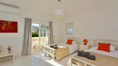 two beds with towels sitting on top of them at Villa Den, private pool villa, Sleeps 6 adults and 2 children, CD 304 - Cleverdetails in Vilamoura