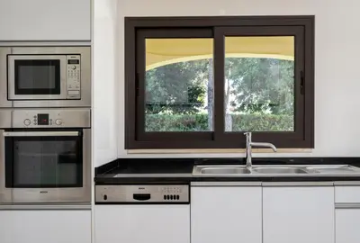 a kitchen with a sink and a window at Villa Lucio by SAPvillas in Vilamoura