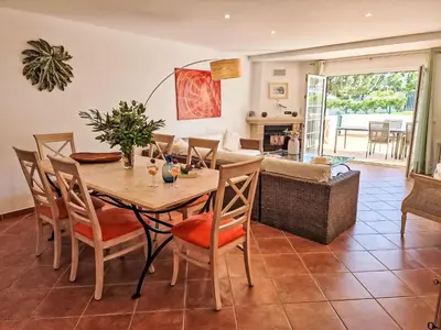 a dining room with a table and chairs at Holiday Home V3 Falésia - Vip Properties by Interhome in Roja- Pé